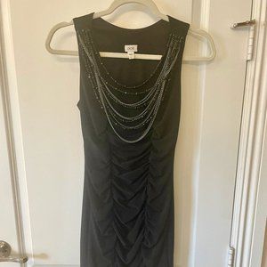 Black cocktail dress with beaded accents by Cache